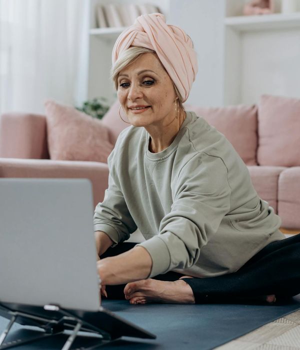 Person in a calm, meditative state after a gentle workout session.