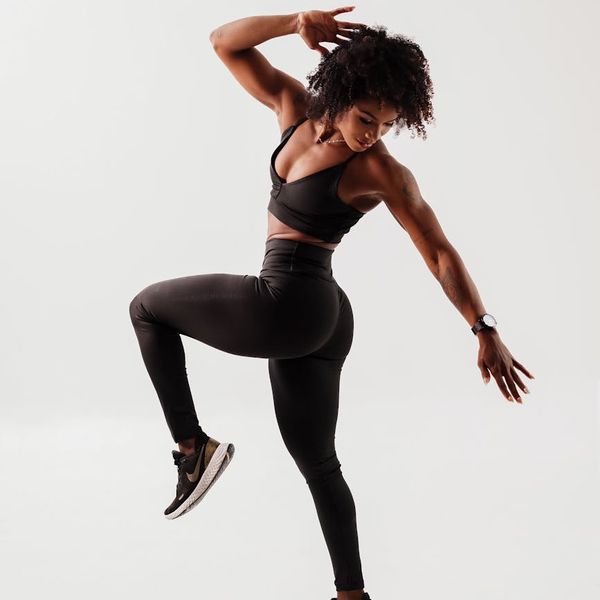 Woman feeling energetic and vibrant during a light cardio workout.